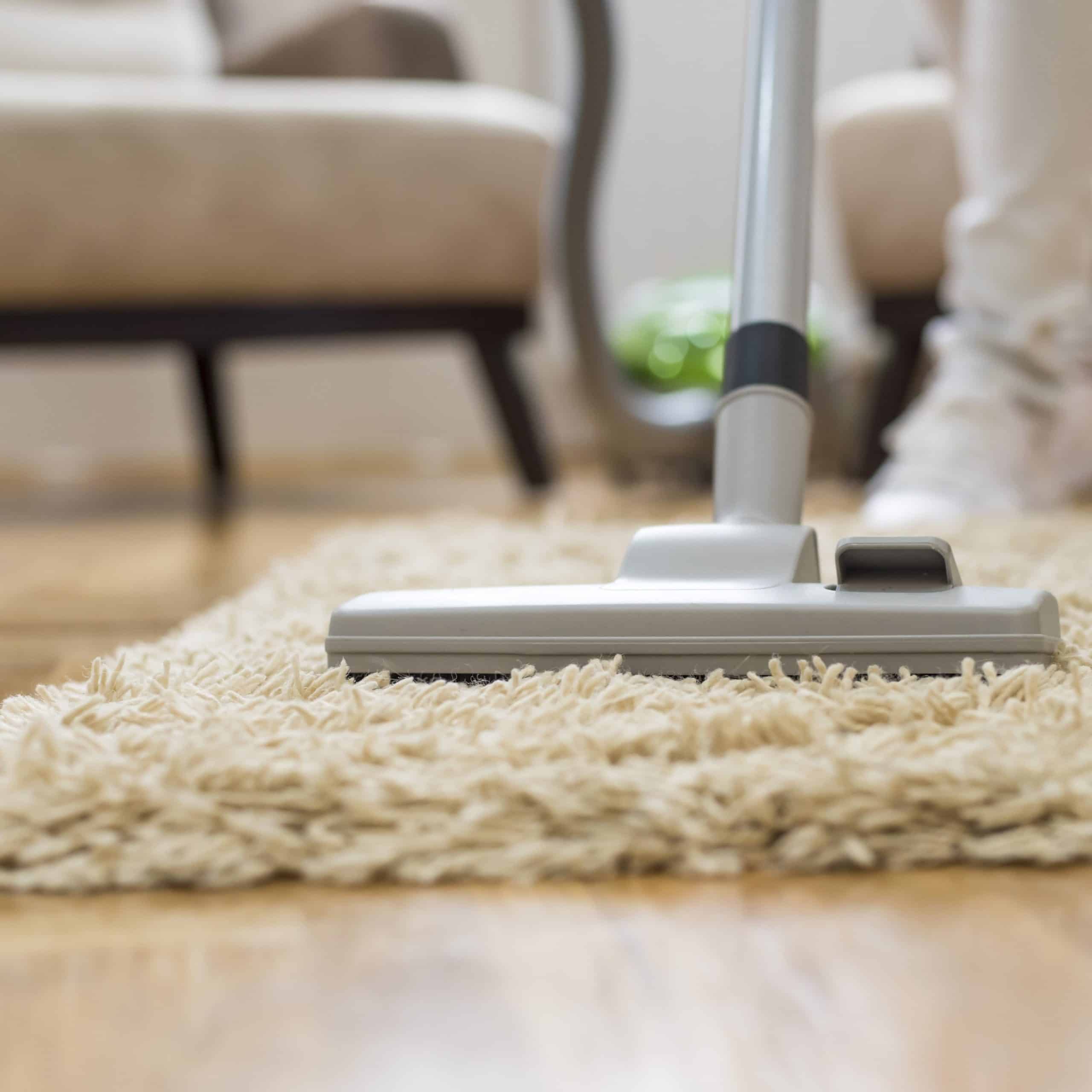 A closeup of a vacuum cleaner at a living room