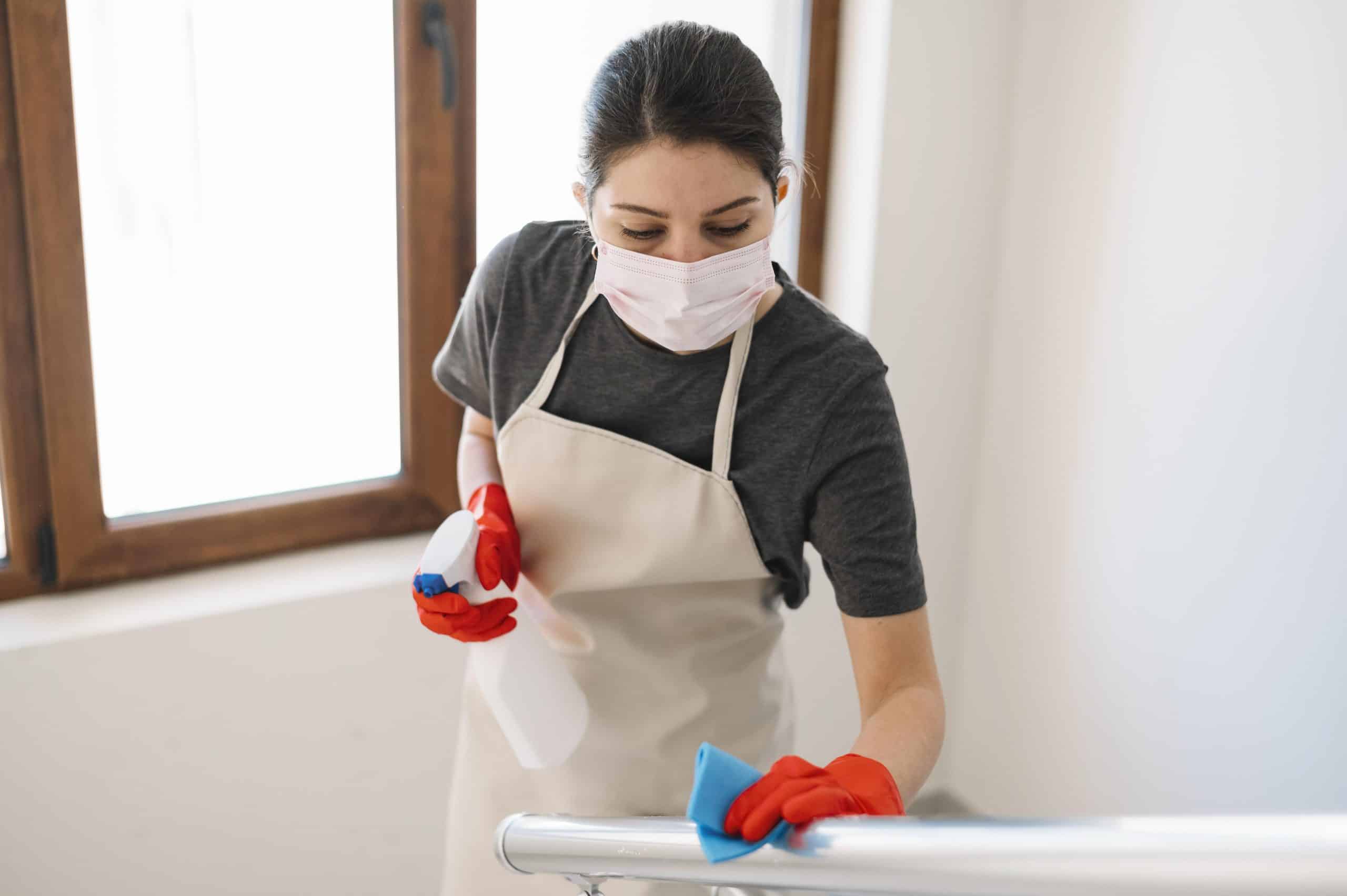 medium-shot-woman-cleaning-railing